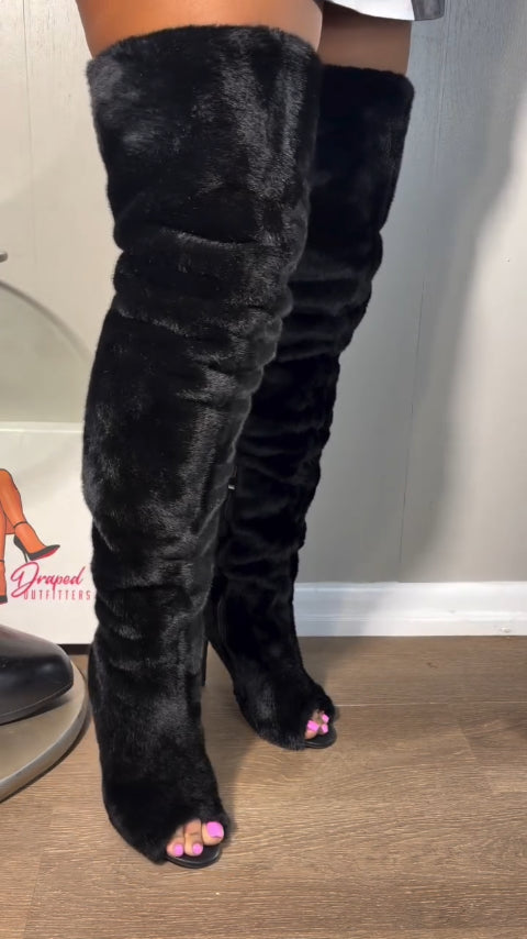 High-heeled, over-the-knee fur boots