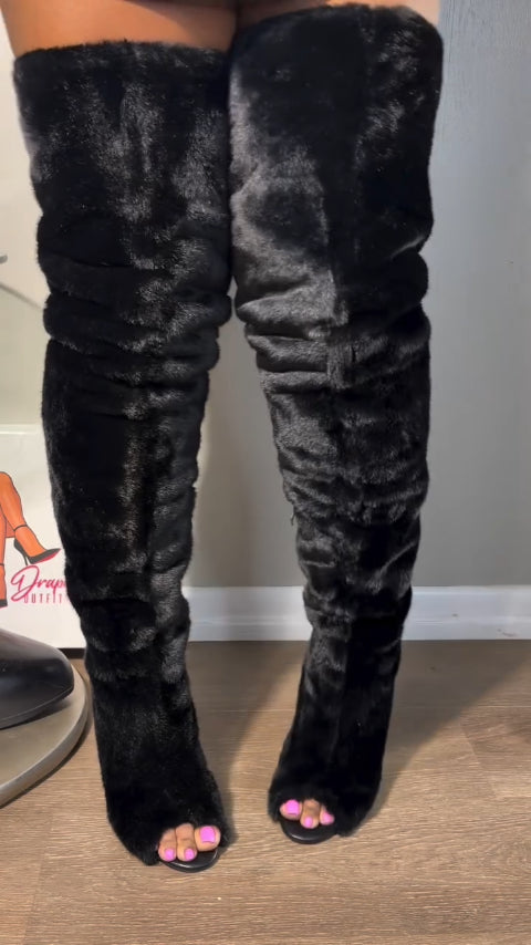 High-heeled, over-the-knee fur boots